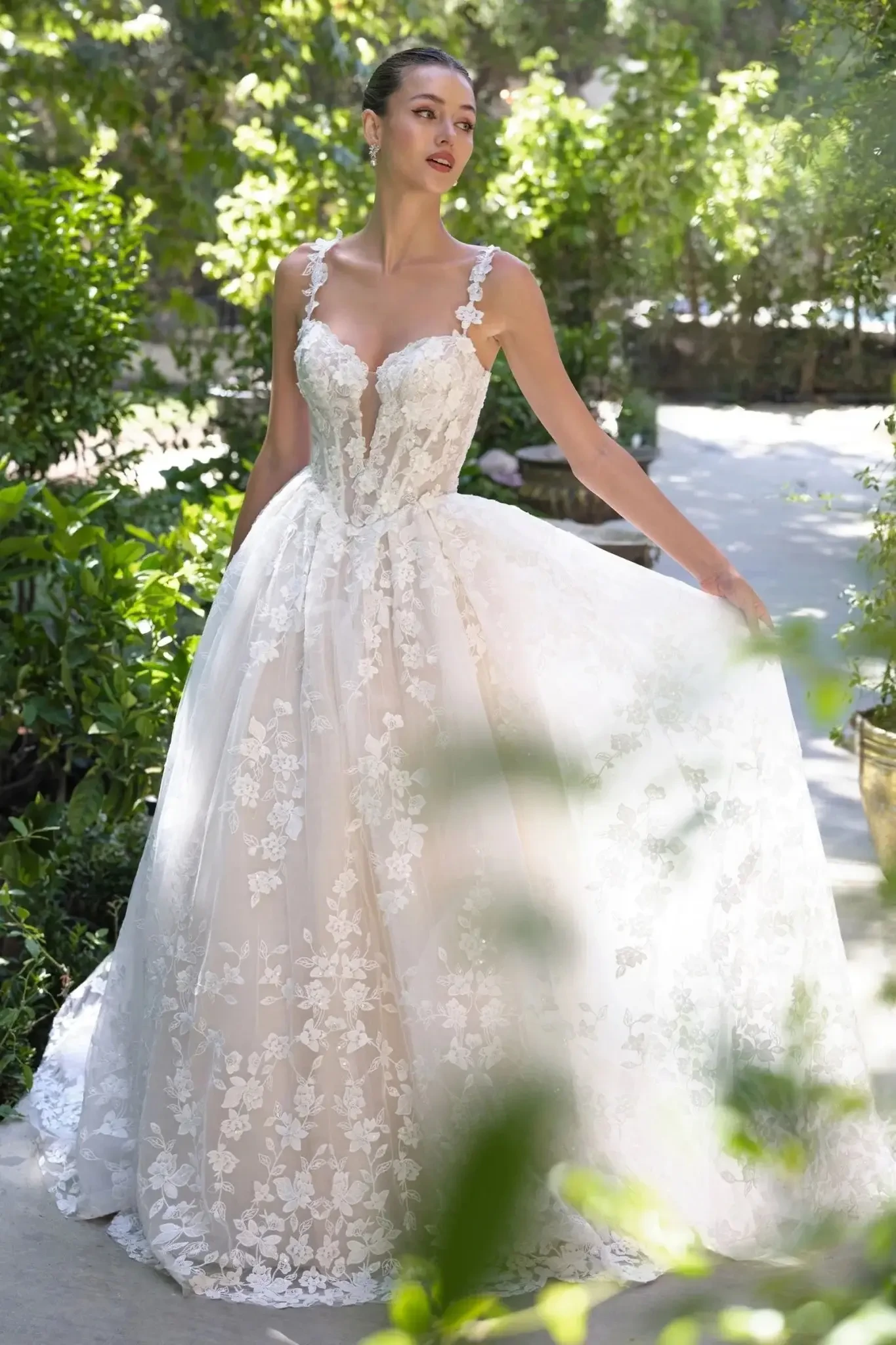 Bride wearing an Andrea & Leo floral lace wedding gown with tulle skirt.